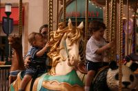 Kelly, Mark, and Andrew on Carousel at Fashion Island